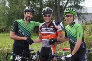 Will Letendre, Matt Surch, and Iain Radford pause to congratulate each other at the finish line.