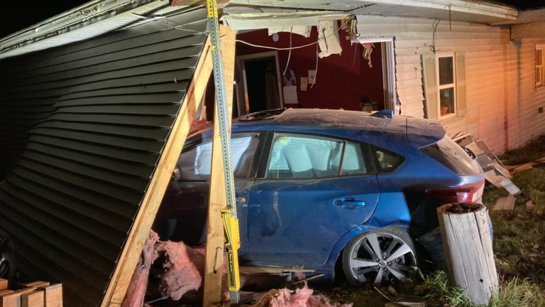Car crashes into home in Jericho